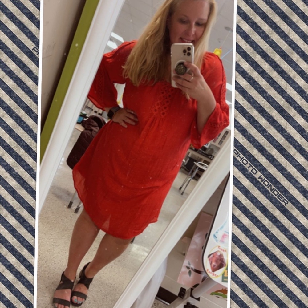 Super cute red knee length dress. Gauzy fabric with a full lining.